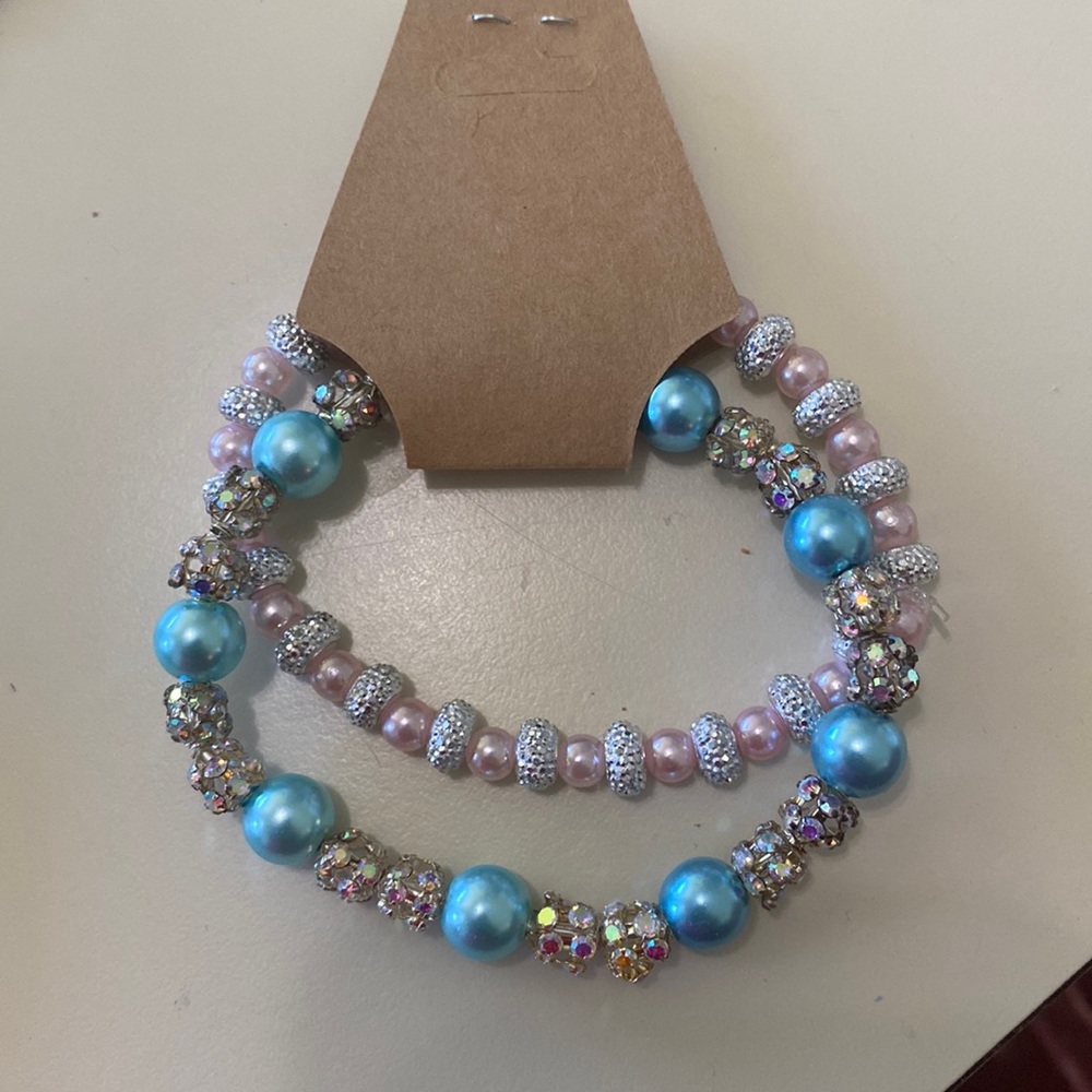 Set of two rhinestone and pearl bracelets. 6 1/2 inches with stretchiness.